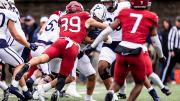 Harvard player #39 tackles Yale player 
