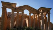 Ancient ruins with tall columns and a blue sky in the background, at Hatra, Nineveh Province, Iraq