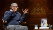 Bill Gates delivers comments at Harvard University, his memoir Source Code displayed