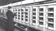 Man selects food from pie compartments in Eighth Avenue Automat, 1936.