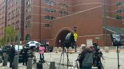 Boston courthouse exterior with television crews lining up across from the courthouse