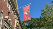 building with flag that says Kenneth C. Griffin Graduate School of Arts and Sciences 