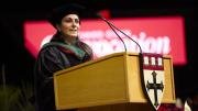 Céline R. Gounder speaks at a podium