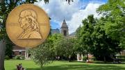 Pulitzer Prize in the foreground with Radcliffe Institute in the background 