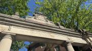 Harvard gates with inscription that reads "Open Ye the Gates That the Righteous Nation Which Keepeth the Truth May Enter In"