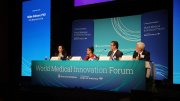 Panel discussion at the World Medical Innovation Forum with four speakers at a table.