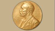 Gold Nobel Prize medal featuring a profile of Alfred Nobel.