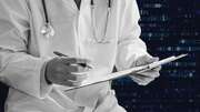 An image of a doctor writing set against a background of code, representing AI