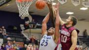 After missing the previous contest against Vermont with a knee injury, senior Patrick Steeves (shown in action against Holy Cross) returned in fine form, scoring 20 points, including a team-high 13 points in the first half, to help boost the Crimson over the Big Green.