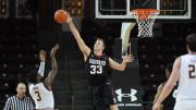 Captain Evan Cummins '16 (also shown in action against BC) blocked three Dartmouth shots and scored 10 points in the win over the Big Green.