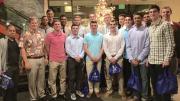 Former Honolulu mayor and Harvard basketball alumnus Mufi Hannemann '76 (first from left in the back row) hosted the team and a group of fellow alumni at a Christmas Eve dinner at a Waikiki restaurant. Following the tournament, Hannemann said he had "never been prouder" of the Harvard team.