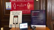 Signs outside the dormitory dining hall specifying rules for access and the need for social distancing.