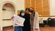 The author and two friends smiling in Holden Chapel together after her performance