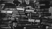 (At left) Bruce Ingram, publisher of the <i>Illustrated London News,</i> posed in 1950 with bound volumes of every edition of the paper since 1842. 