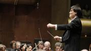 Gilbert on the podium with the Philharmonic last year