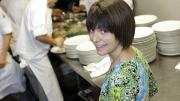Too many cooks  in the kitchen? Not for LaRochelle and her staff, who are preparing citrus-marinated grilled mojo chicken with apple-raisin chutney for a wedding banquet. 