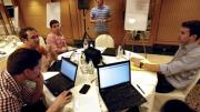 Back at their hotel, the students (from left)—Thomas Lydick, Steven Pearson, Frederic Dijols, Chris Bruce, Nafis Atiqullah, and Jeff Suer—regroup to consider what they will recommend. 