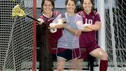 Triple image of a double threat: Baskind stands between her two sports' goals