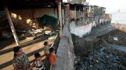 Residents of South Mumbai’s Machhimar Nagar (fishing village) wait for fishermen to return with the day’s catch.