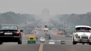 The <em>Rajpath,</em> or King’s Way, in New Delhi runs from the federal government complex to the India Gate monument (seen through morning fog in the distance). It is the route for the annual Republic Day parade.