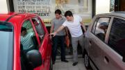 Nick Phoutrides and Diverio tour the car lot.