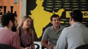 Josh Petersel, Nyssa Liebermann, and Phoutrides interview a customer.