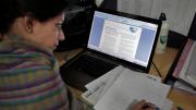 Khanna's students also learn about PRS Legislative Research, a Delhi-based nonprofit organization that provides research briefs to members of Parliament on bills they are considering. Here, a researcher works on a brief in the PRS office.
