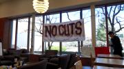 Demonstrators in Lamont Café protested possible cuts to library staff.