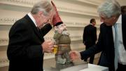 A viewer pumps the headgear of a <i>Pissing Gnome,</i> causing the gnome to urinate beer. 