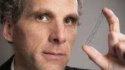 David Jones holds a vascular stent (from the Warren Anatomical Museum), designed circa 1995 by radiologist Morris Simon of Harvard Medical School.