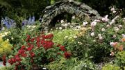 A stone archway leads to the rose garden at Blithewold