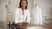 Designer Katiti Kirondé with her white shirts at the Fashion Lab of Fisher College in Boston