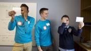 In one of the Ed Portal’s new mentoring spaces, Christ White ’15 (center) teaches fellow undergraduate Tyreke White ’15 and 12-year-old Allston resident Mehdi Kayi about optical illusions.