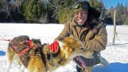 William Greenlaw ’17 poses with a harnessed dog