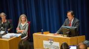 DGAC committee member Frank Hu presents research as colleagues Miriam Nelson (far left) and committee chair Barbara Millen listen.