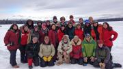 Students, guides, and House Master Anne Harrington (far left) pose on the frozen lake.