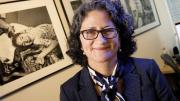 Pediatric palliative-care specialist Joanne Wolfe hangs pictures of patients in her office.