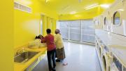 A laundry room in the New Carver Apartments