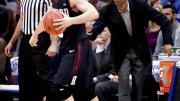Coach Tommy Amaker is trying to shape a young Crimson squad, including freshman point guard Tommy McCarthy, shown in action against the University of Kansas.