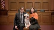 Chris Green and Kristen Stilt in Austin Hall’s Ames courtroom with Lola, Stilt’s rescue dog from Egypt