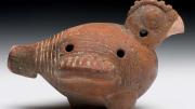 Four-hole ocarina of a bird that resembles a squat chicken