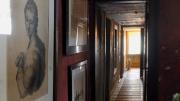 A hallway with hanging artwork in The Evergreens