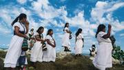 Women making offerings to the Magdalena River in Colombia