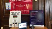 Photograph of posters displaying coronavirus rules at the entrance to Adams House dining hall.