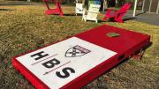 Harvard Business School logo on a campus cornhole board
