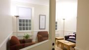 Photograph by Rose Lincoln/Harvard News Office A life-size model of a renovated Old Quincy suite includes a hallway, a "cluster" common room, a bathroom, a single bedroom, and a double bedroom set up in the parking garage at One Western Avenue, where contractors, architects and administrators can tour the mock-up. Click the "right arrow" below or use the arrow buttons on your keyboard to see more images.