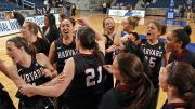 The women's basketball team celebrates their victory over Hofstra last night as they became the first team in Ivy League history to record a win in the WNIT.