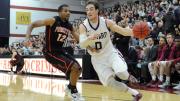 Senior captain Laurent Rivard drives past Princeton's Ben Hazel at Lavietes Pavilion. The Crimson swept both the Penn and Princeton home-and-away series this year for the first time in history.