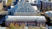 The façade of the new 204,000-square-foot Renzo Piano-designed facility rises from the back of 32 Quincy Street.
