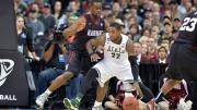 Steve Moundou-Missi '15, shown in last year's NCAA tournament (where Harvard very much hopes to return this season), anchored the Crimson with 17 points and 11 rebounds against Columbia last Saturday.
